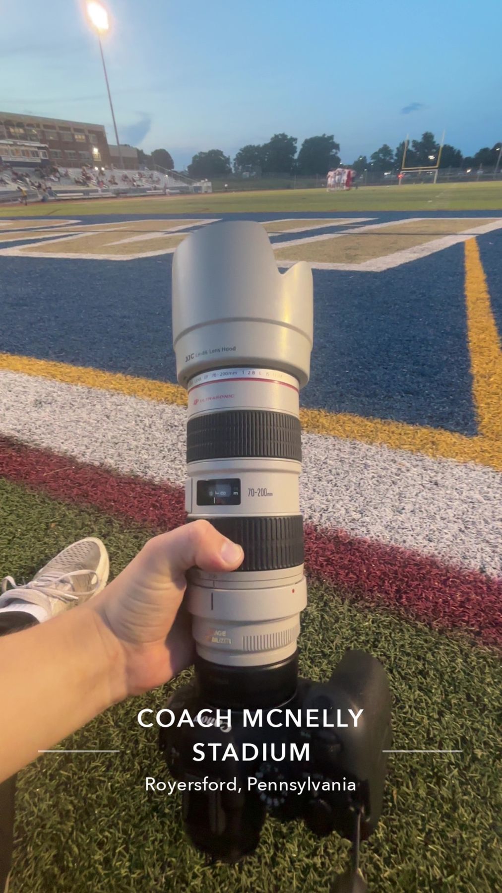 The 70-200mm lens Max shoots with, on the field at Coach McNelly Stadium